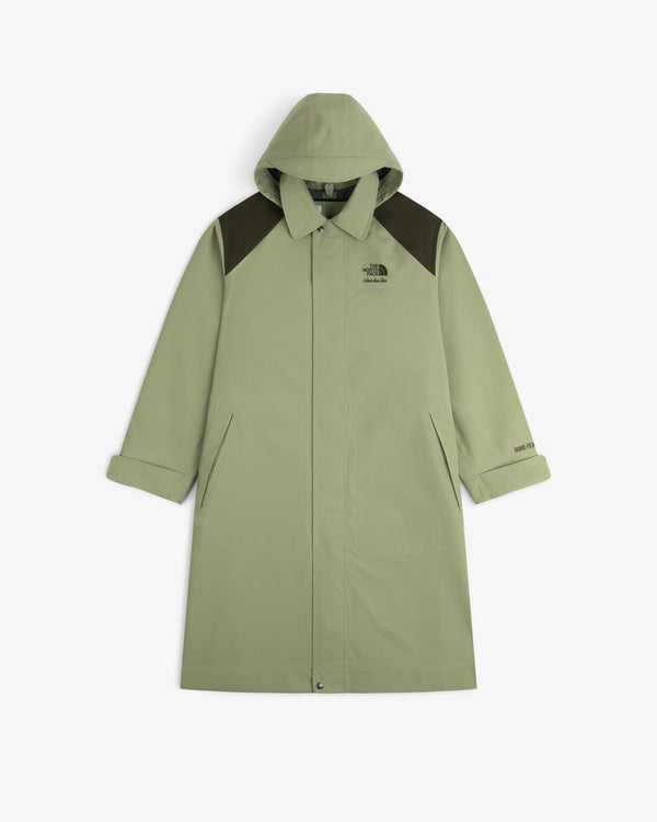 ALD/The North Face GORE-TEX Trench Coat in light green with dark shoulders, front buttons, and slanted pockets on white.