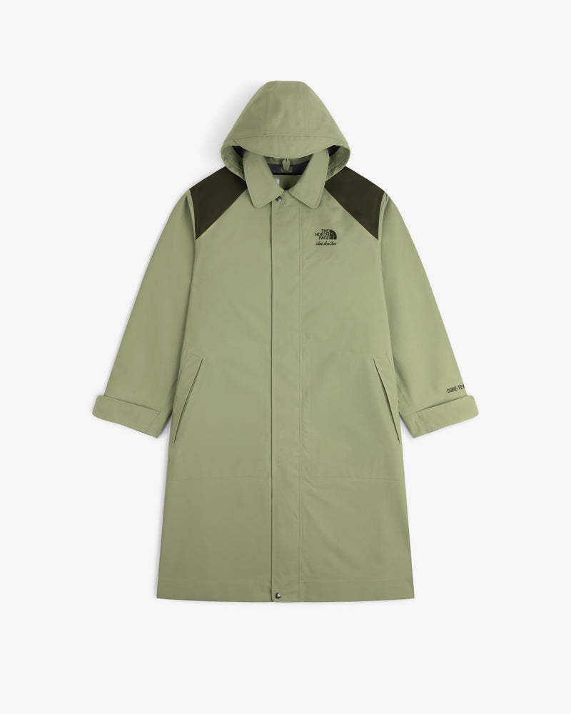 ALD/The North Face GORE-TEX Trench Coat in light green with dark shoulders, front buttons, and slanted pockets on white.