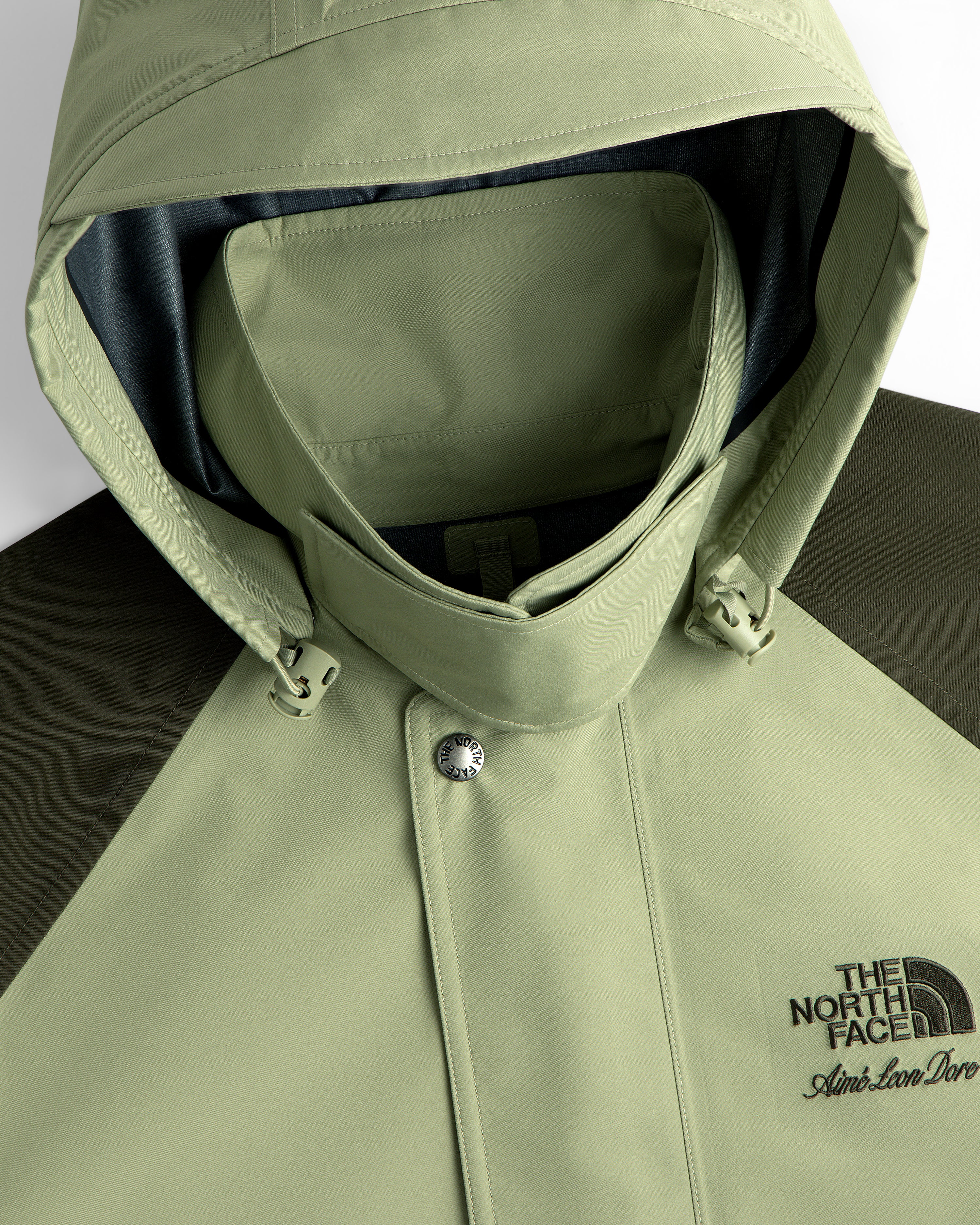 Light green ALD/The North Face GORE-TEX Trench with embroidered logos on the chest.