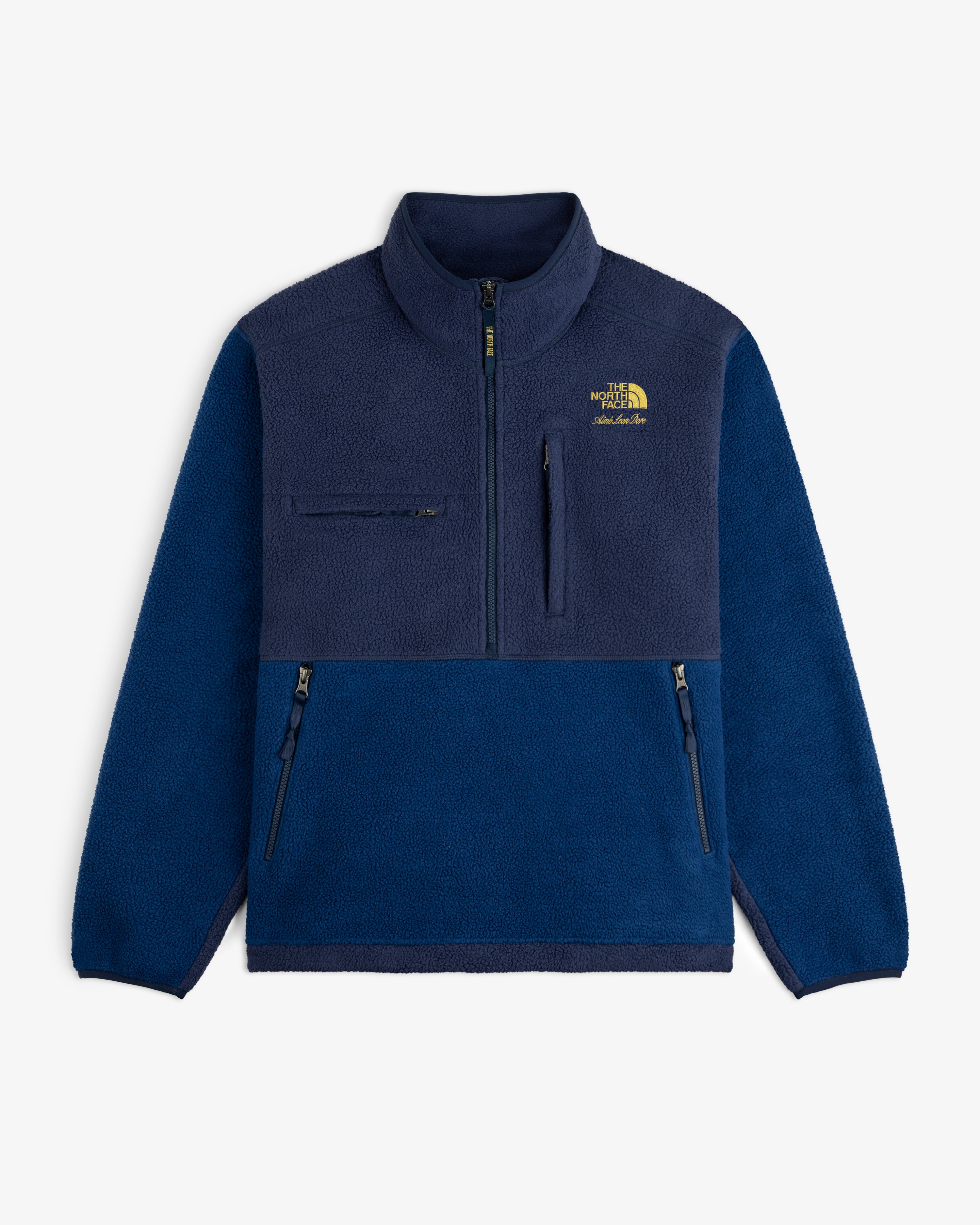 ALD / The North Face ’95 Denali navy fleece pullover with three zip pockets and yellow logo on left chest.
