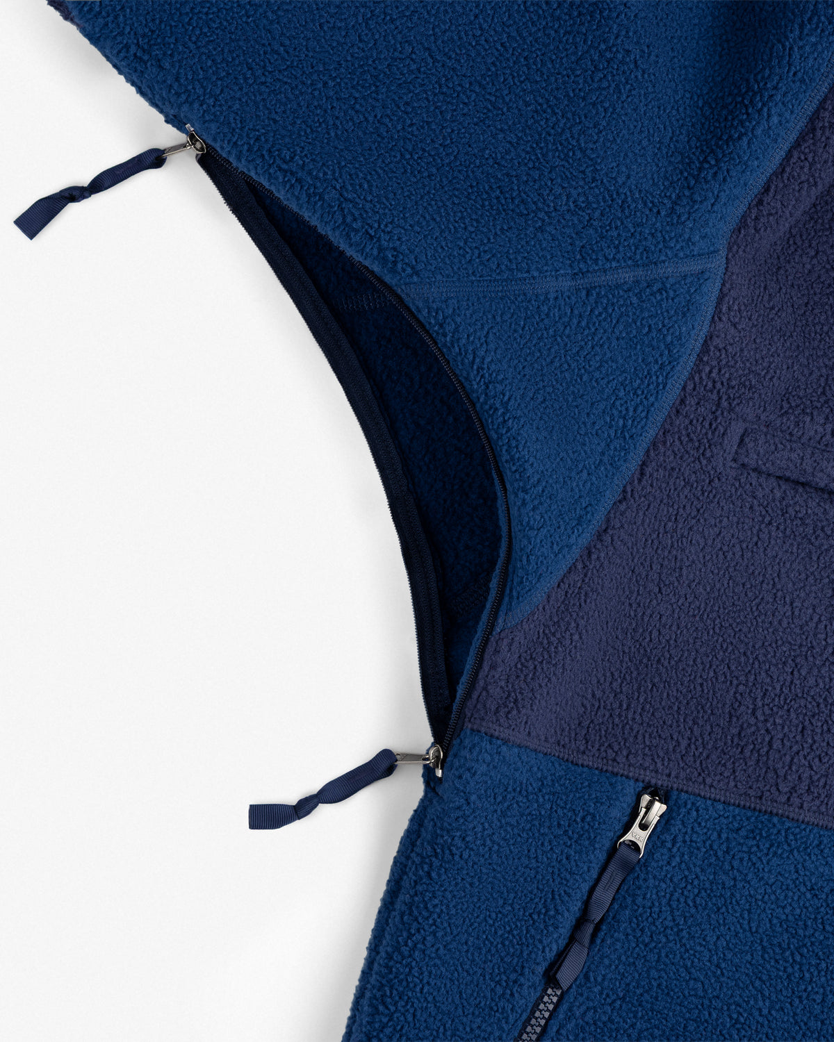 Close-up of ALD / The North Face ’95 Denali Half-Zip Fleece Pullover with zippers partially open, showing mixed textures.