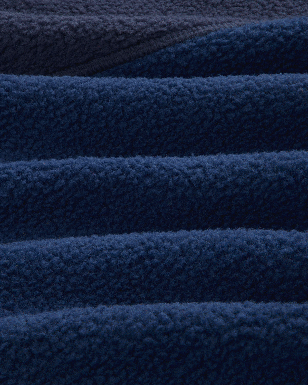 Close-up of navy blue ALD/The North Face ’95 Denali Half-Zip Fleece Pullover showing soft, fluffy texture.