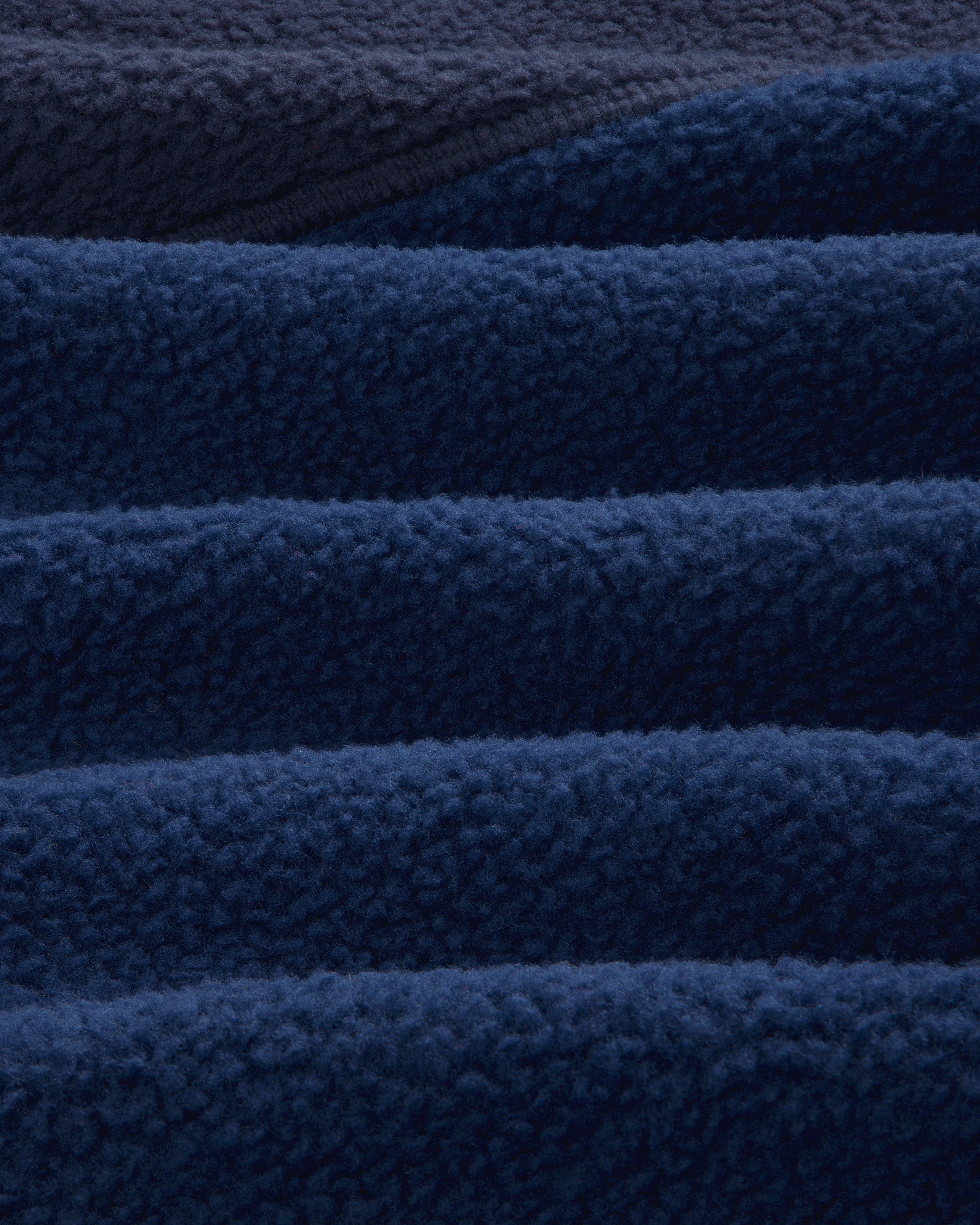 Close-up of navy blue ALD/The North Face ’95 Denali Half-Zip Fleece Pullover showing soft, fluffy texture.