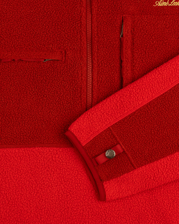 Close-up of the ALD/The North Face ’95 Denali Half-Zip Fleece Pullover showing zipper, pocket, and buttoned cuff.