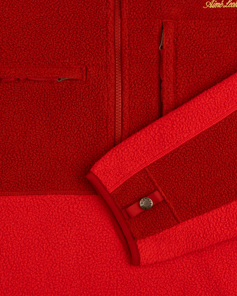 Close-up of the ALD/The North Face ’95 Denali Half-Zip Fleece Pullover showing zipper, pocket, and buttoned cuff.