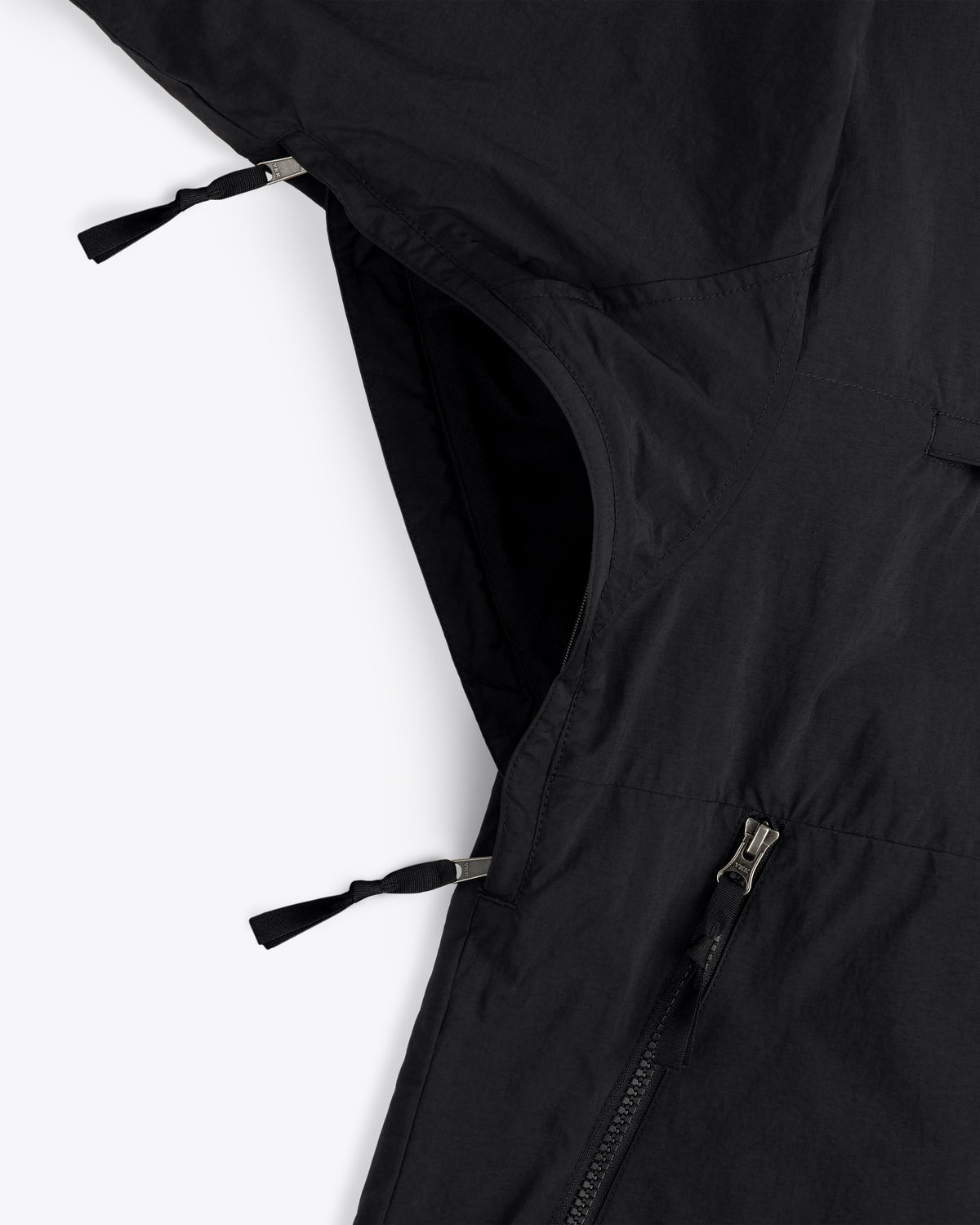 Close-up of the ALD / The North Face Nylon Denali Jacket with zippered side vent and pocket pull tabs.