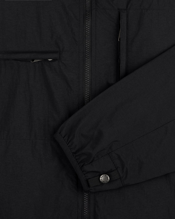 Detailed view of ALD / The North Face Nylon Denali Jacket sleeve with snap cuff, zipper, and chest zip pocket.
