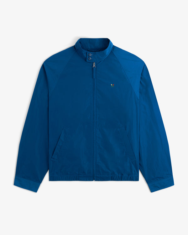 Crest Nylon Windbreaker in bright blue with stand collar, zip-up front, and two pockets on white background.