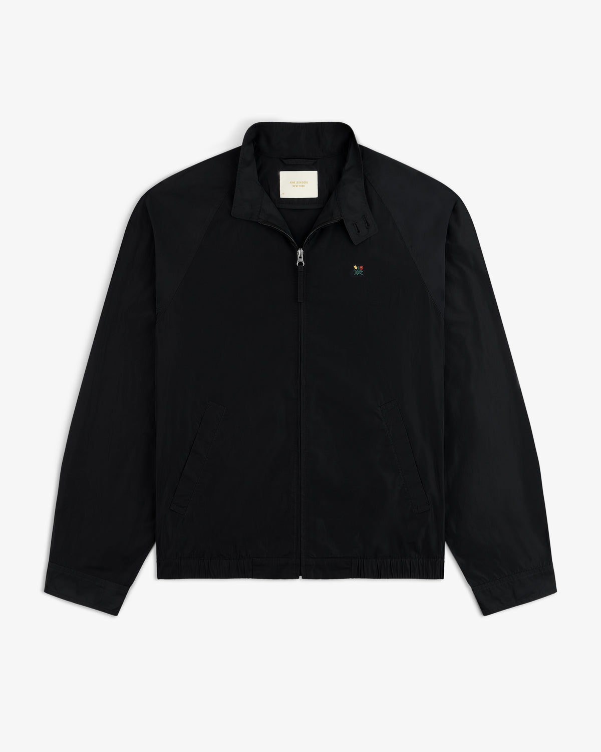 Crest Nylon Windbreaker: Black zip-up with side pockets, chest logo, and a straight collar.