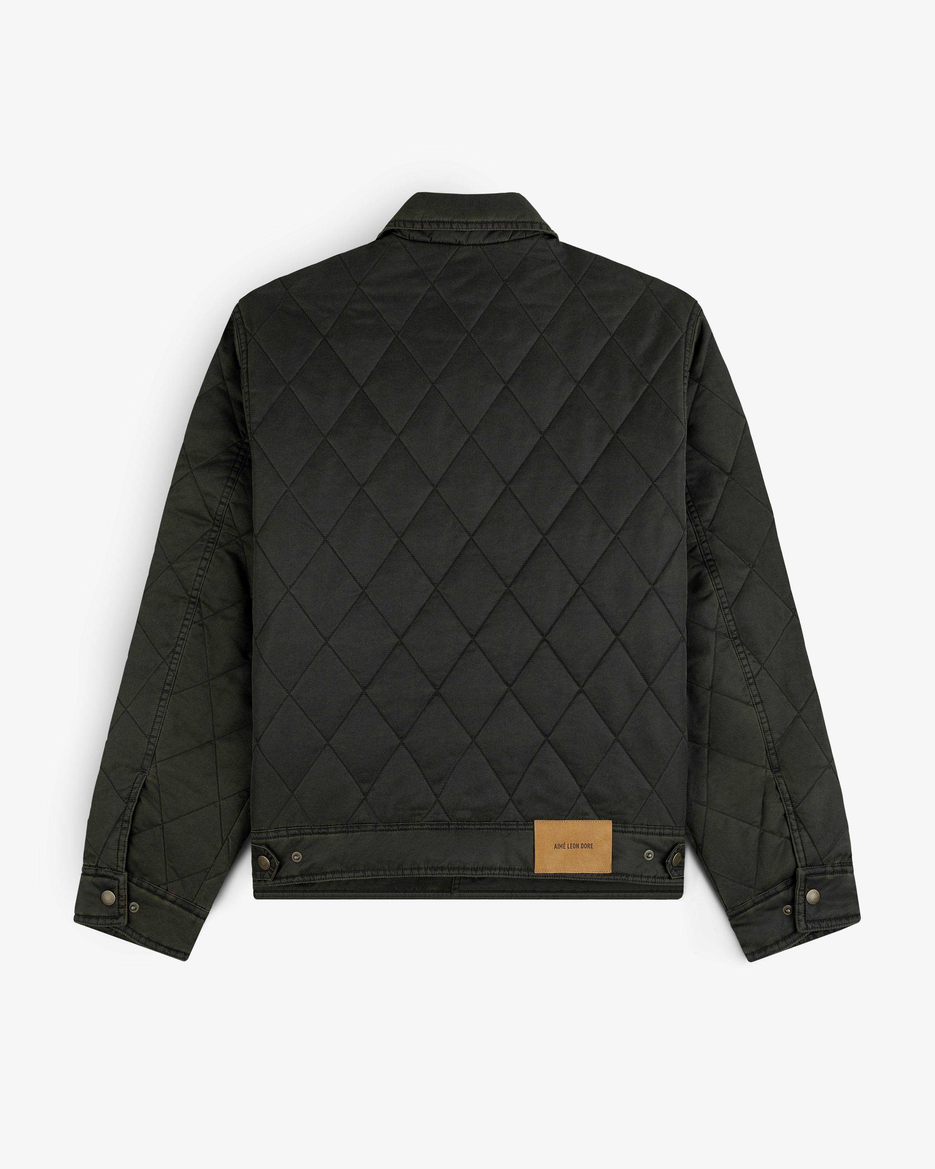 Back view of a dark olive green Quilted Trucker Jacket with a tan leather brand patch at the hem.