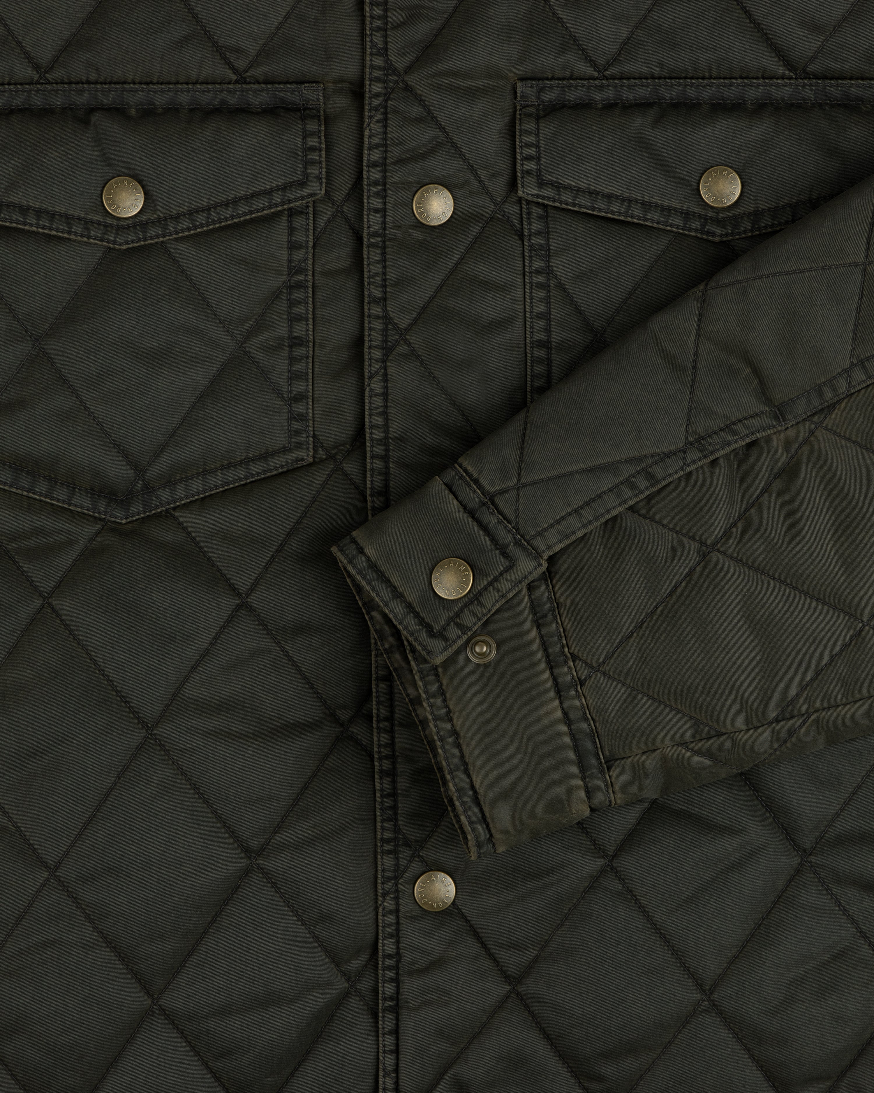 Olive green Quilted Trucker Jacket with metal buttoned chest pockets and sleeve cuffs.