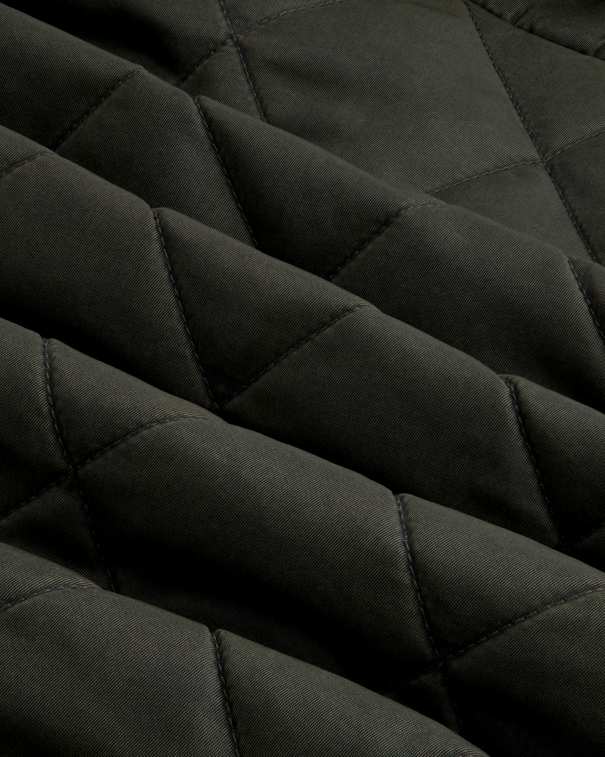 Dark green Quilted Trucker Jacket with a diamond-patterned quilted texture.