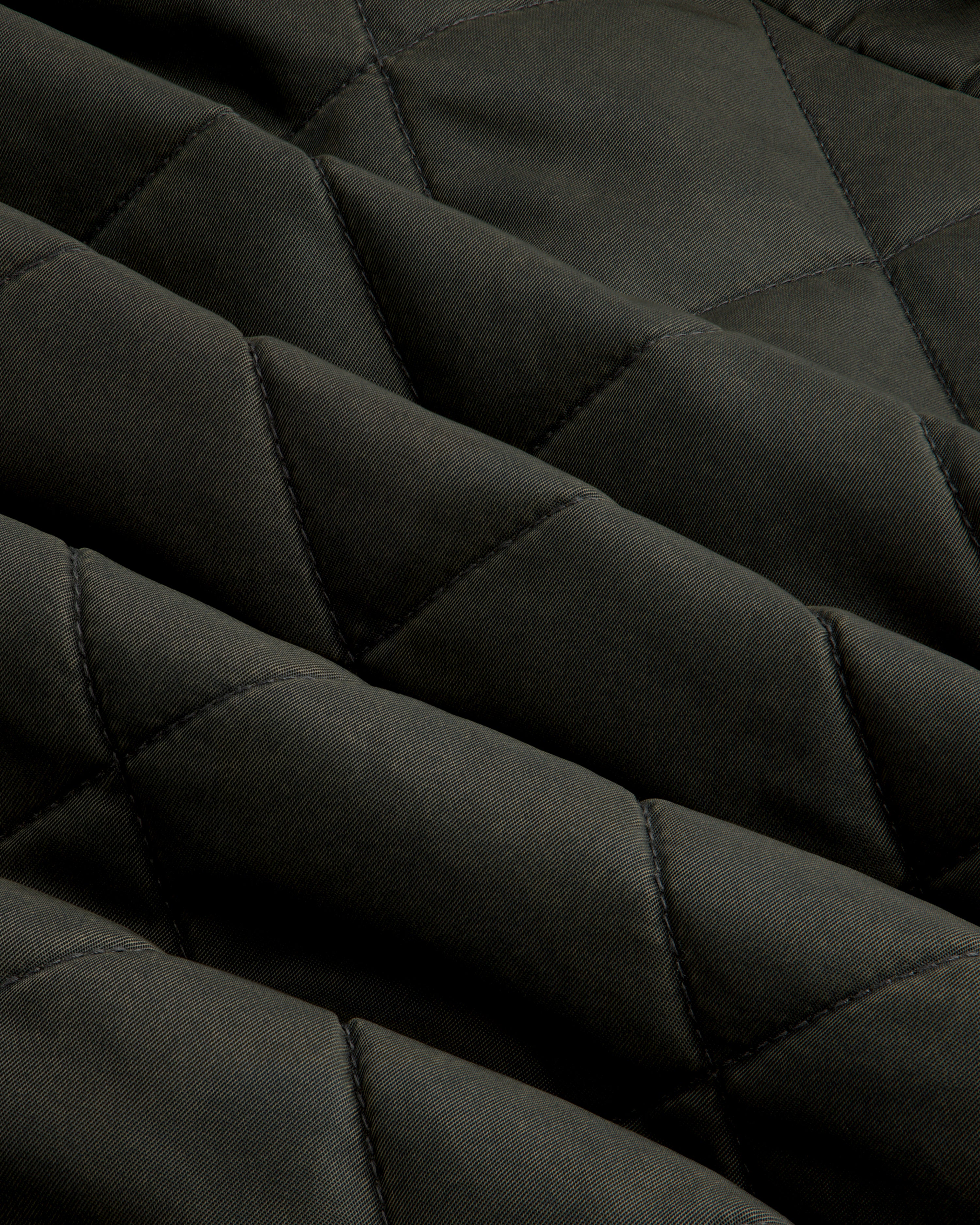 Dark green Quilted Trucker Jacket with a diamond-patterned quilted texture.