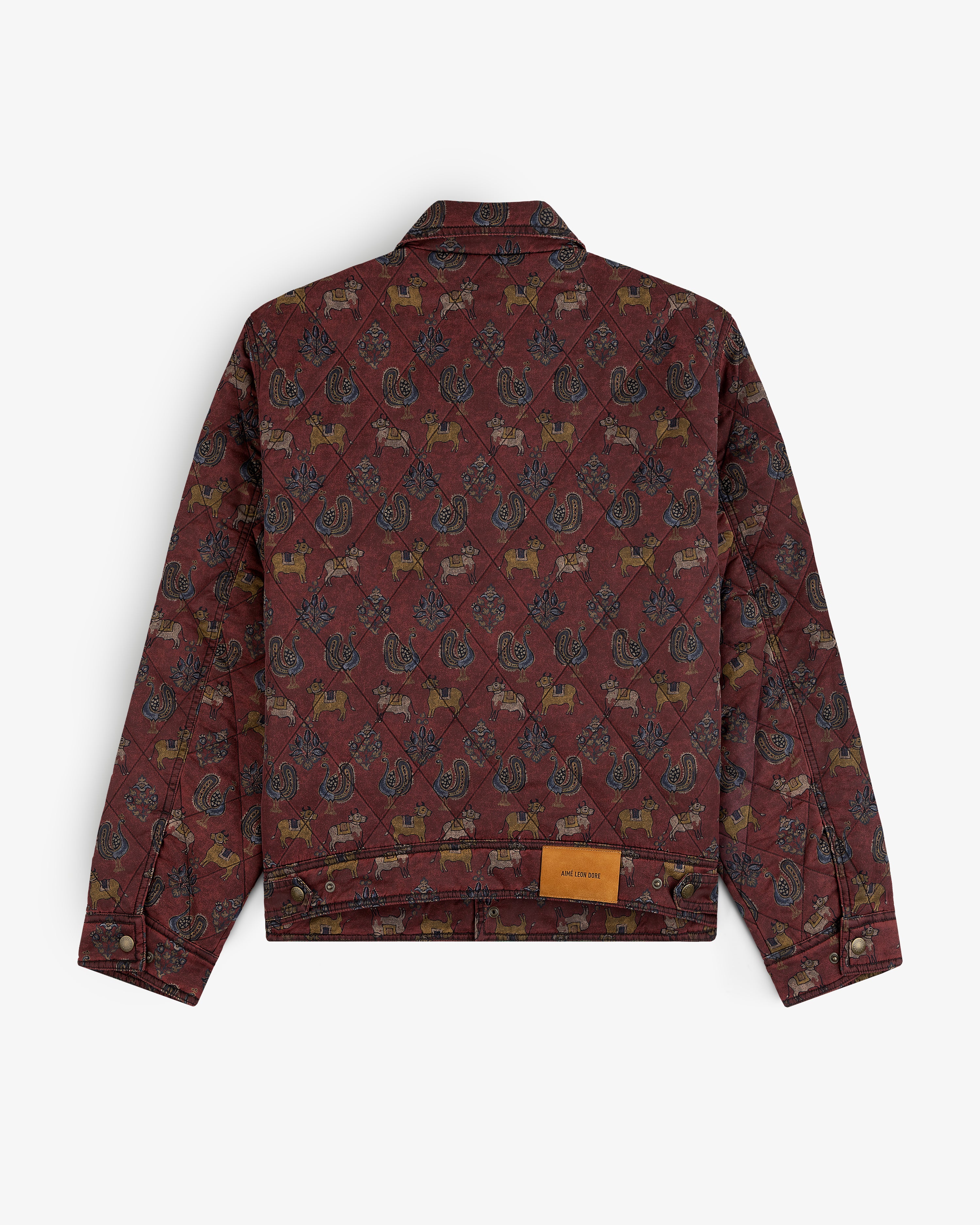 Burgundy Quilted Trucker Jacket with a repeating pattern of small animals and paisley motifs.