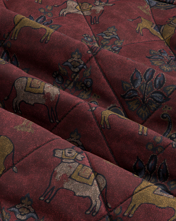Deep red Quilted Trucker Jacket with a pattern of stylized animals and floral motifs.