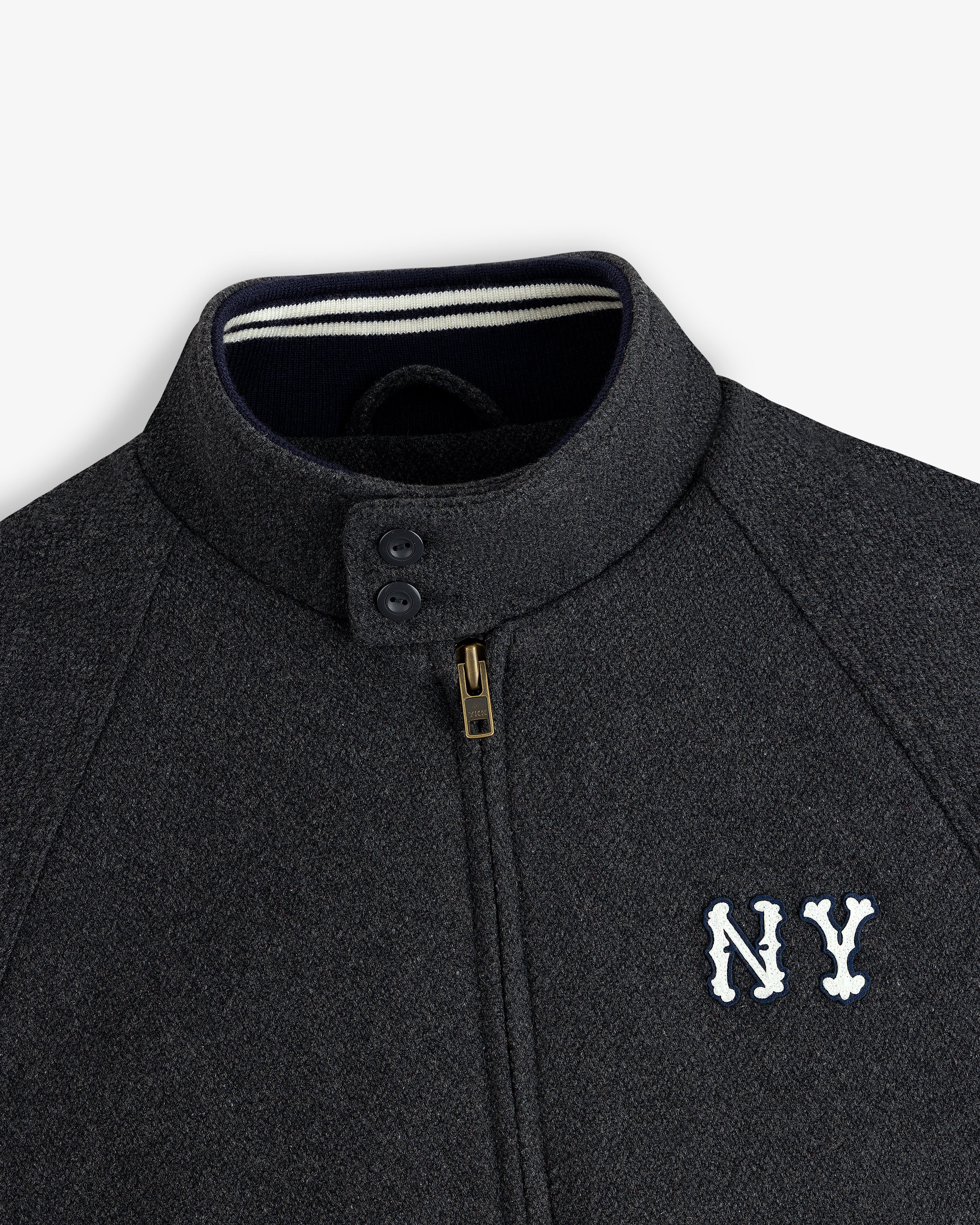 NY Highlanders Wool Varsity Jacket in dark gray with NY chest embroidery, zip closure, and two collar buttons.