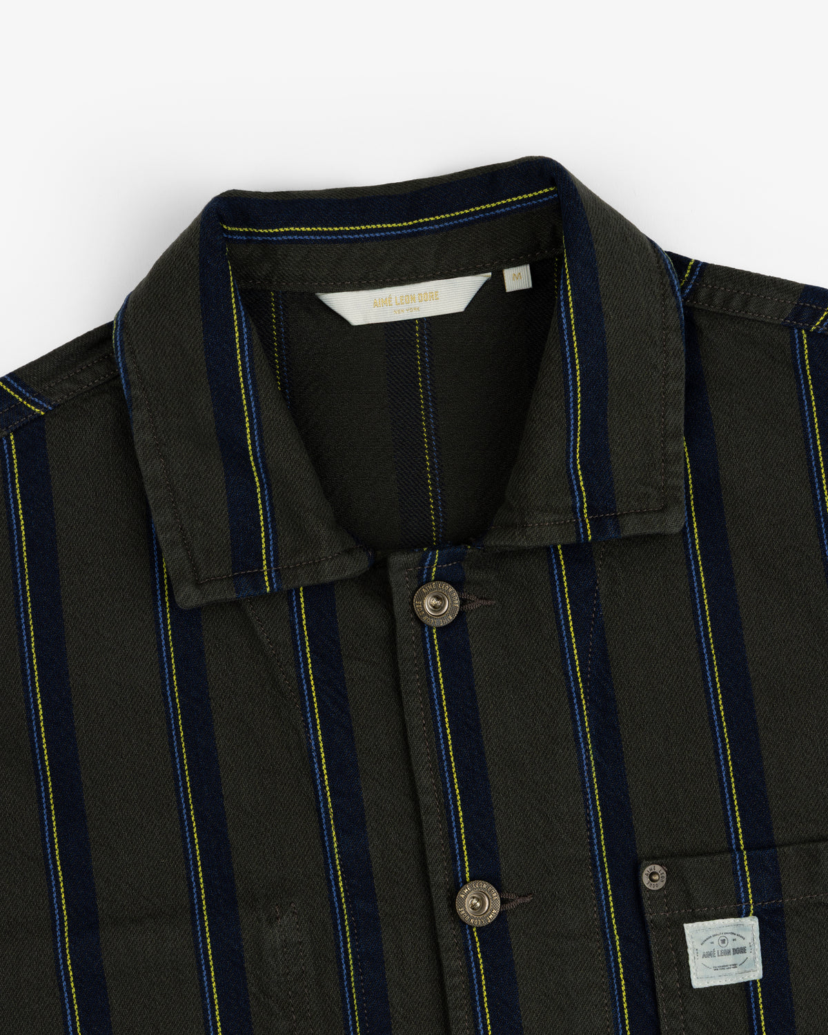 Striped Denim Chore Jacket with blue and yellow stripes, button front, collar, and chest pocket label.