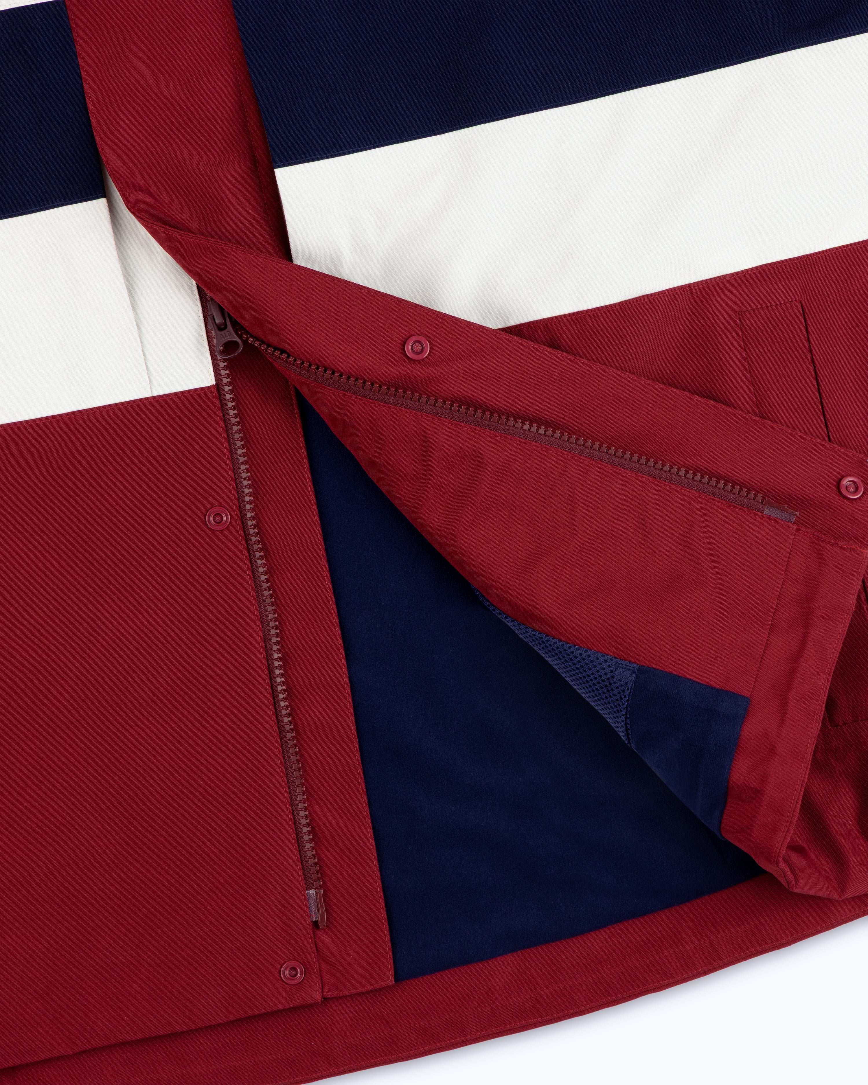 Close-up of the GORE-TEX Striped Sailing Jacket, partially unzipped to display its lining.