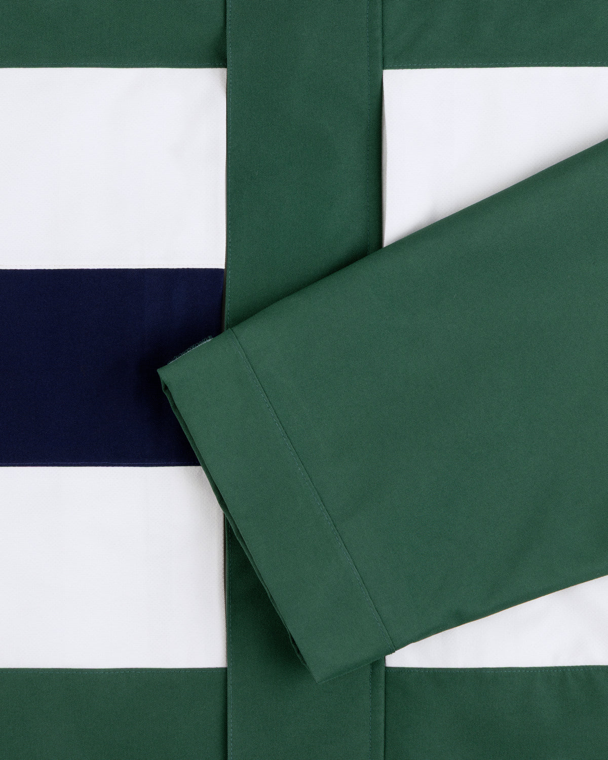 Green sleeve over GORE-TEX Striped Sailing Jacket in green, white, and navy horizontal stripes.