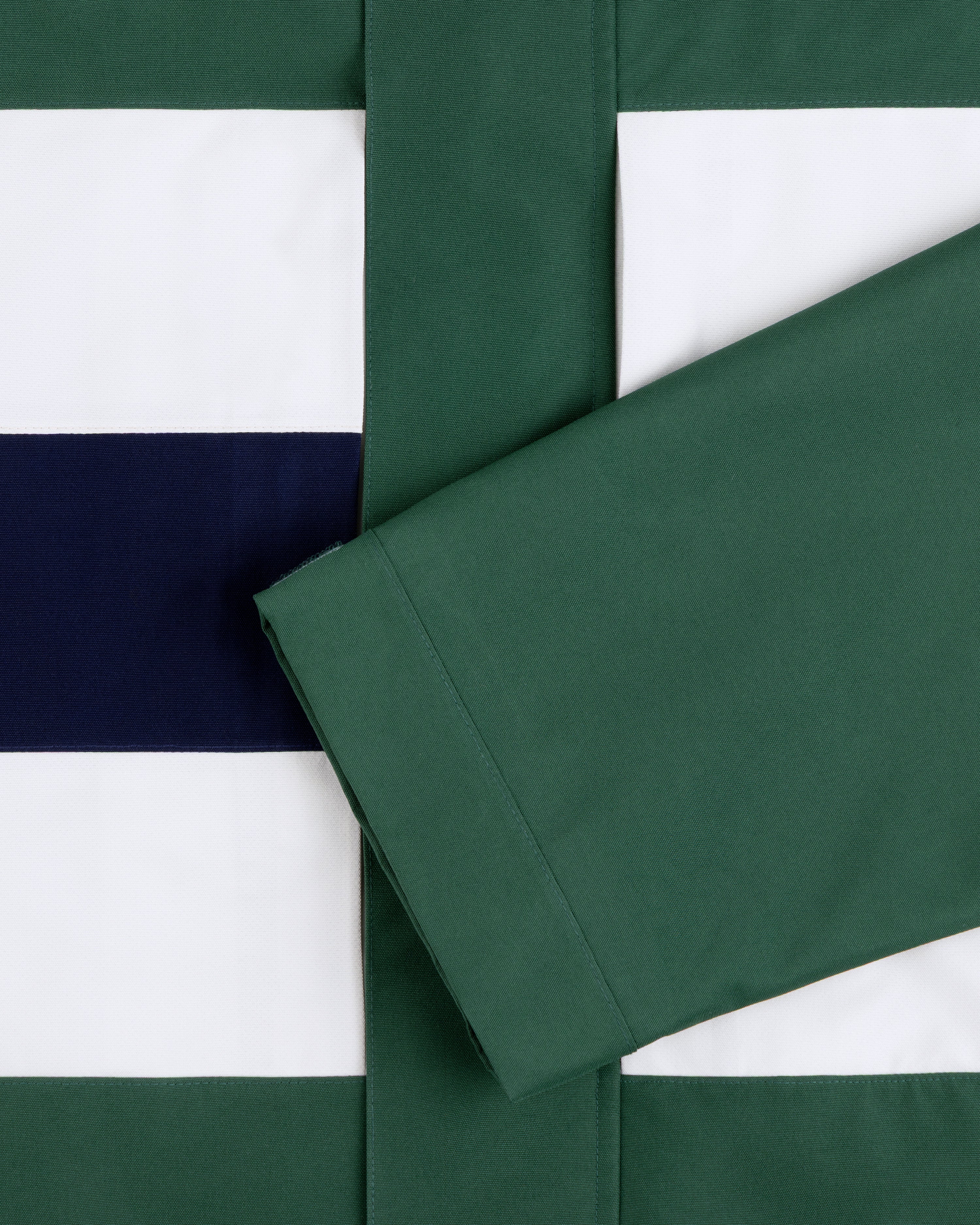 Green sleeve over GORE-TEX Striped Sailing Jacket in green, white, and navy horizontal stripes.