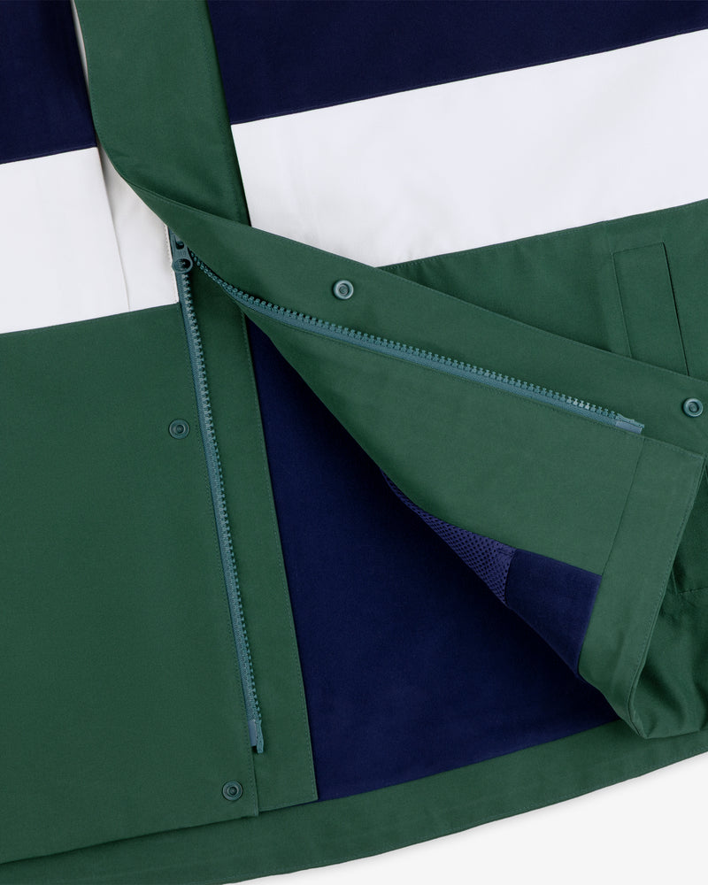 Close-up of the GORE-TEX Striped Sailing Jacket in green, navy, and white with open zipper and snap button flap.