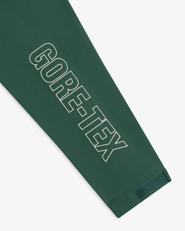 Green sleeve on the GORE-TEX Striped Sailing Jacket with bold white logo and Velcro cuff strap.