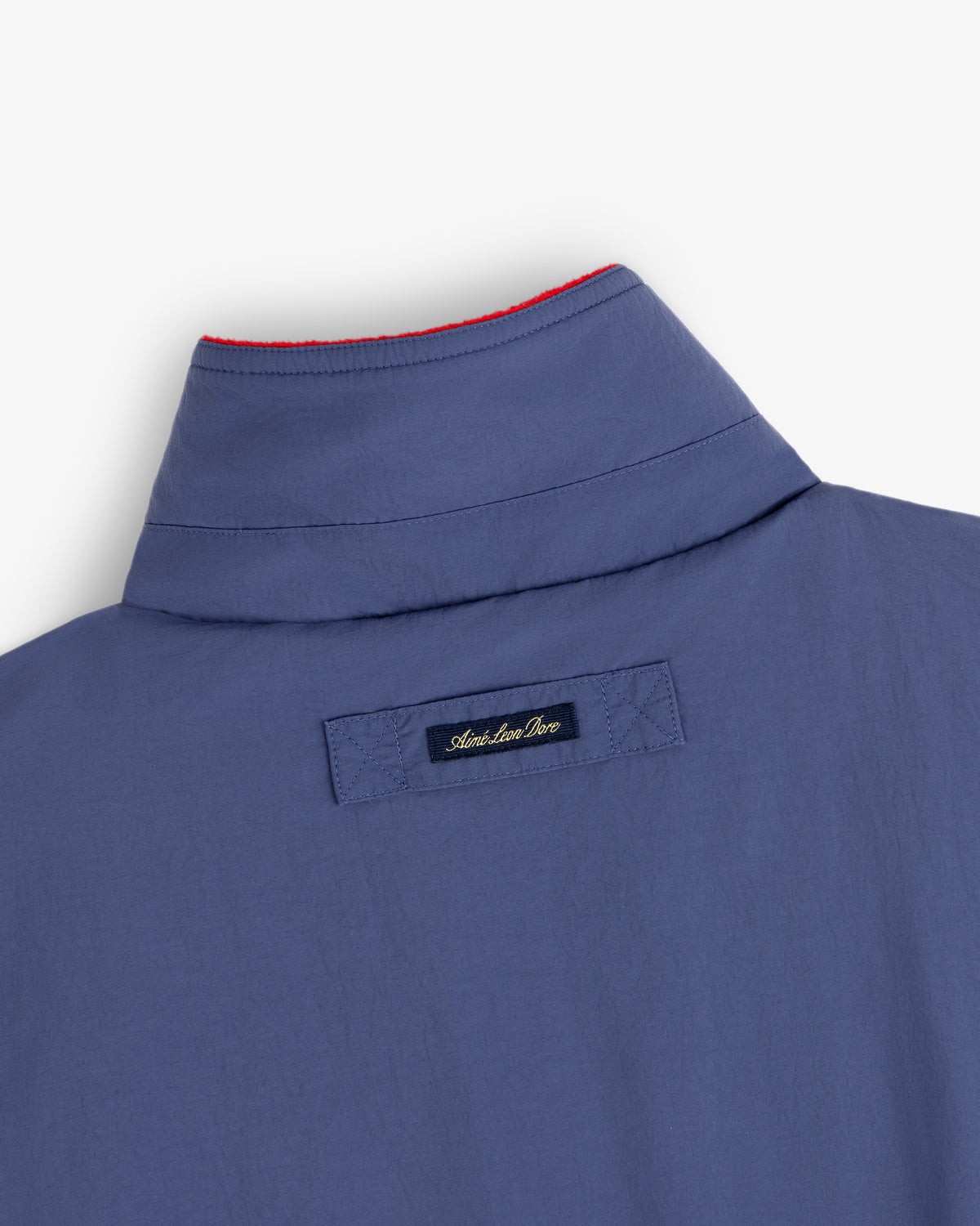 Fleece Lined Sport Windbreaker with tag reading Adam Lippes Live and red stitching along the inside collar edge.