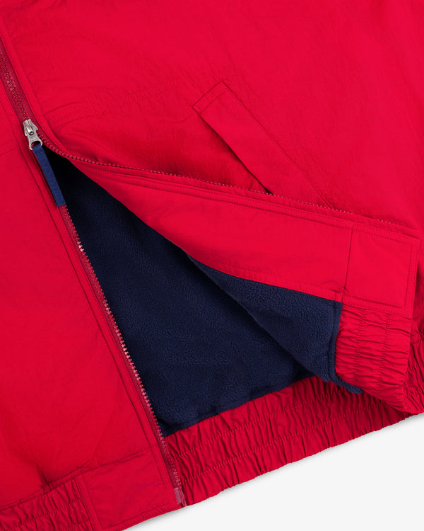 Fleece Lined Sport Windbreaker in red with a zipper, dark blue lining, and an elastic hem.