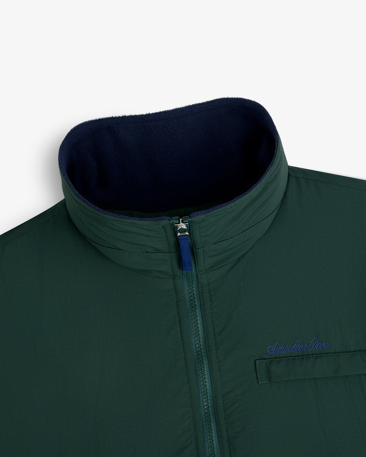 Fleece Lined Sport Windbreaker: green zip-up, high collar, navy lining, chest pocket with Aimé Leon Dore embroidery.