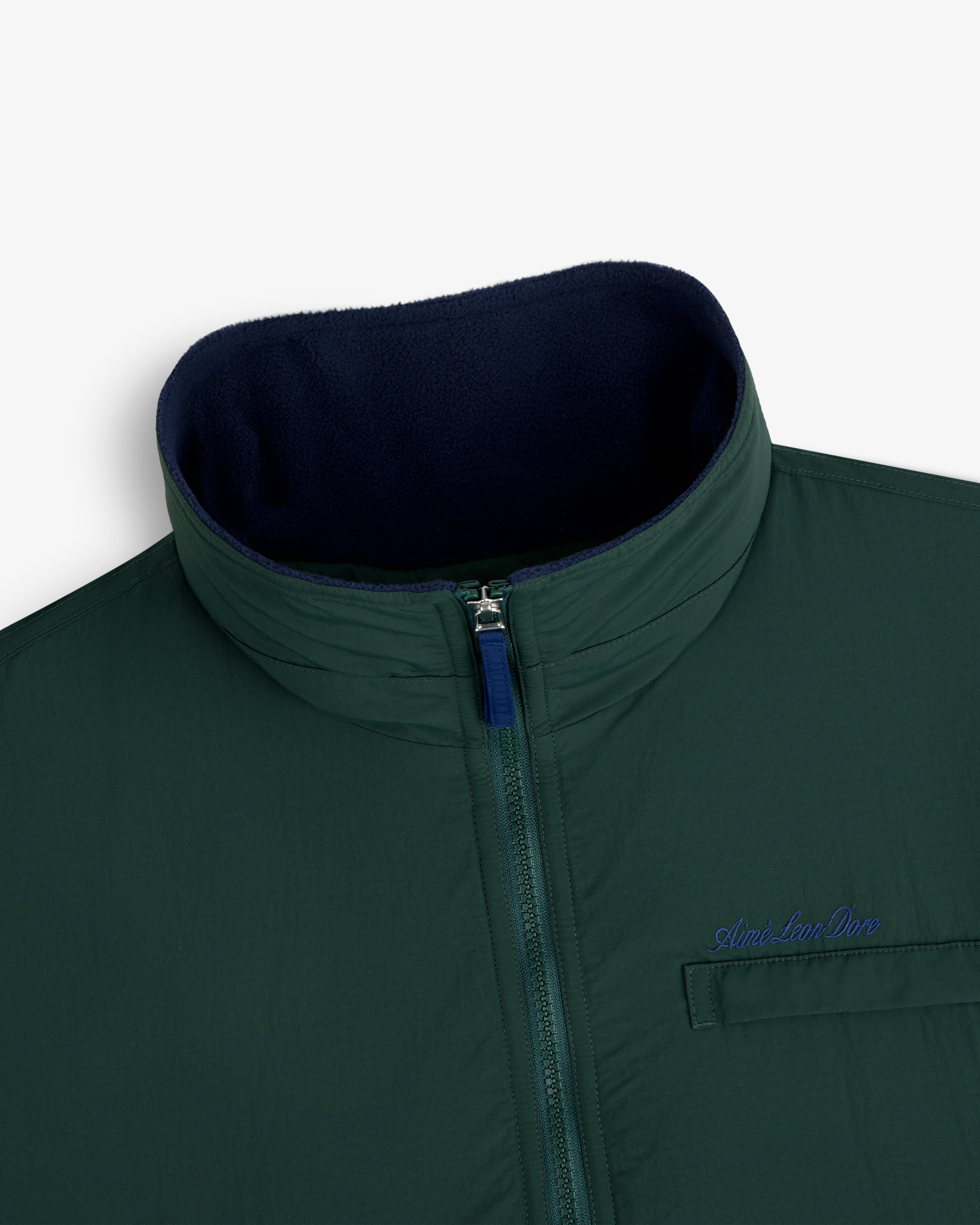 Fleece Lined Sport Windbreaker: green zip-up, high collar, navy lining, chest pocket with Aimé Leon Dore embroidery.