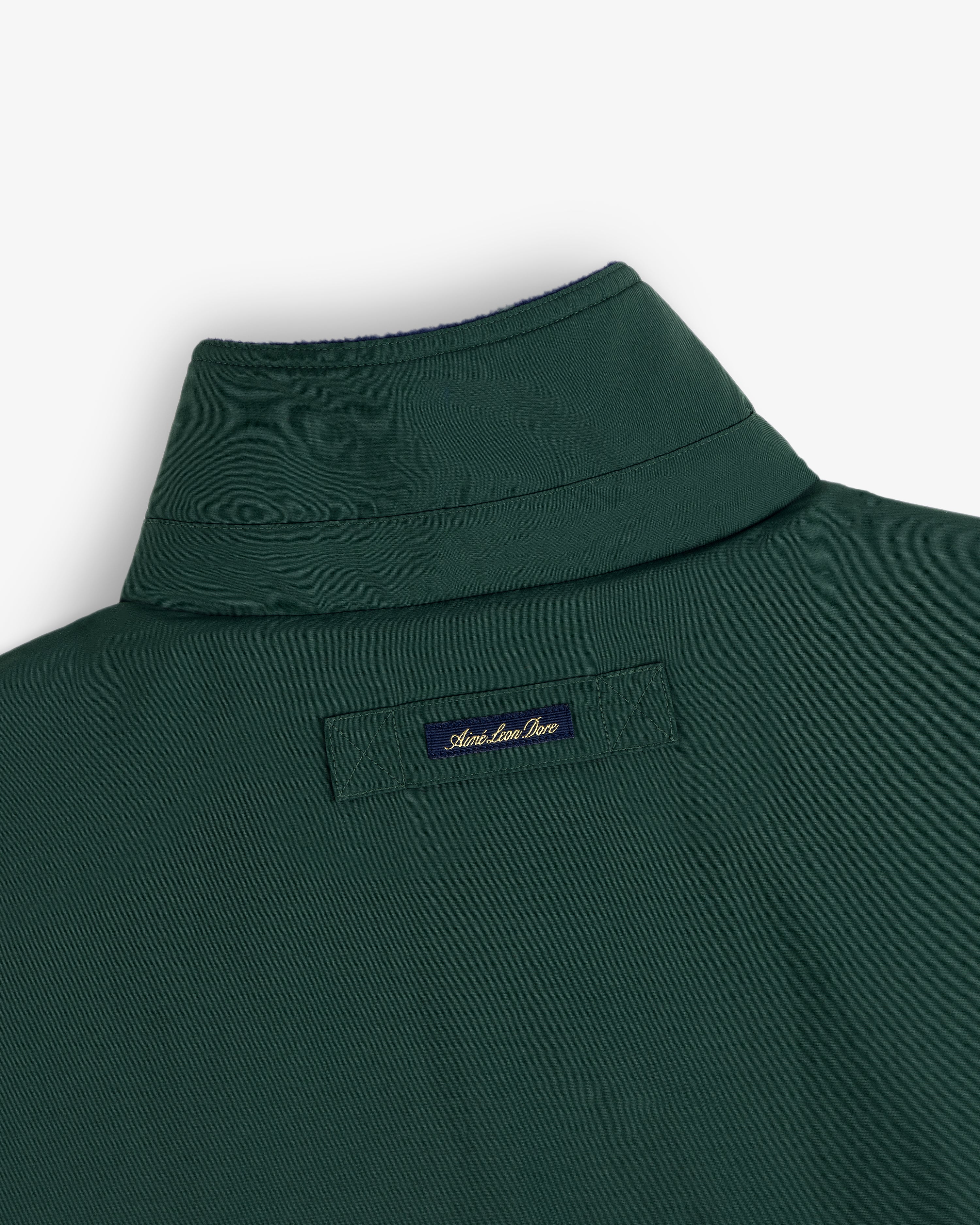 Dark green Fleece Lined Sport Windbreaker, navy American Hero label sewn on upper back below the collar.