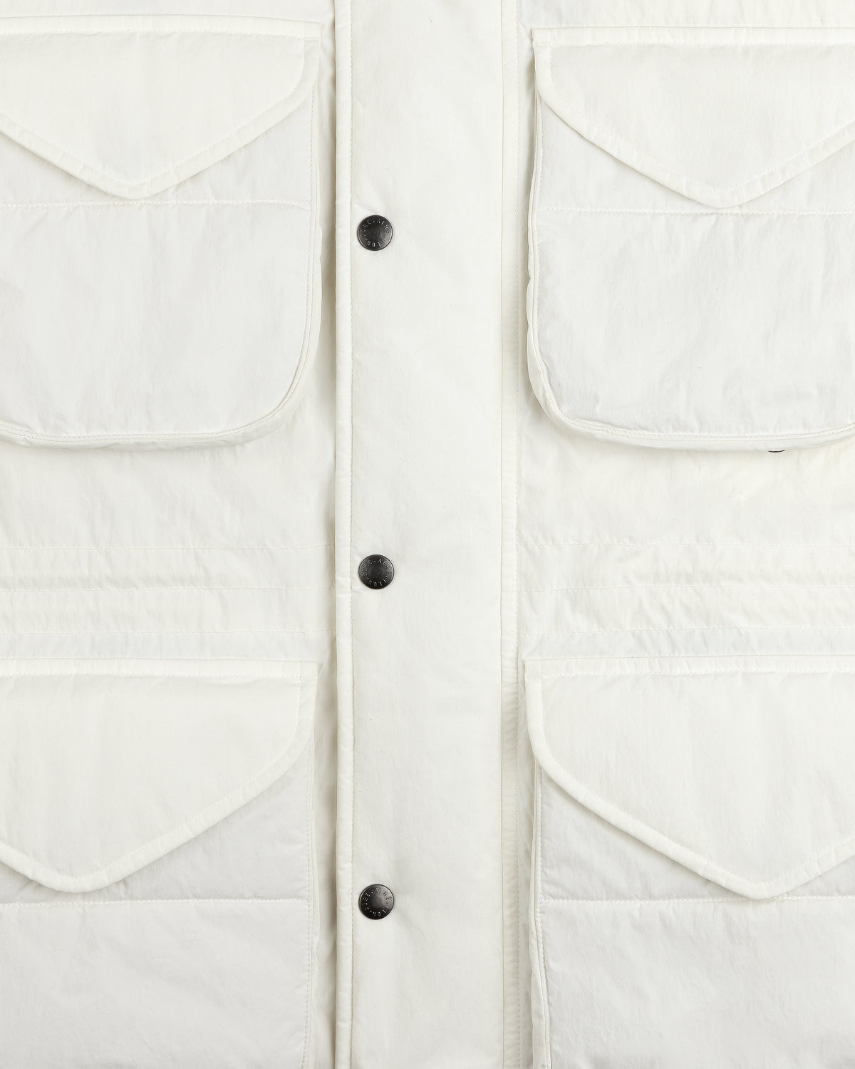 Off-white Down-Filled Surplus Parka with four flap pockets and a central snap-button closure.