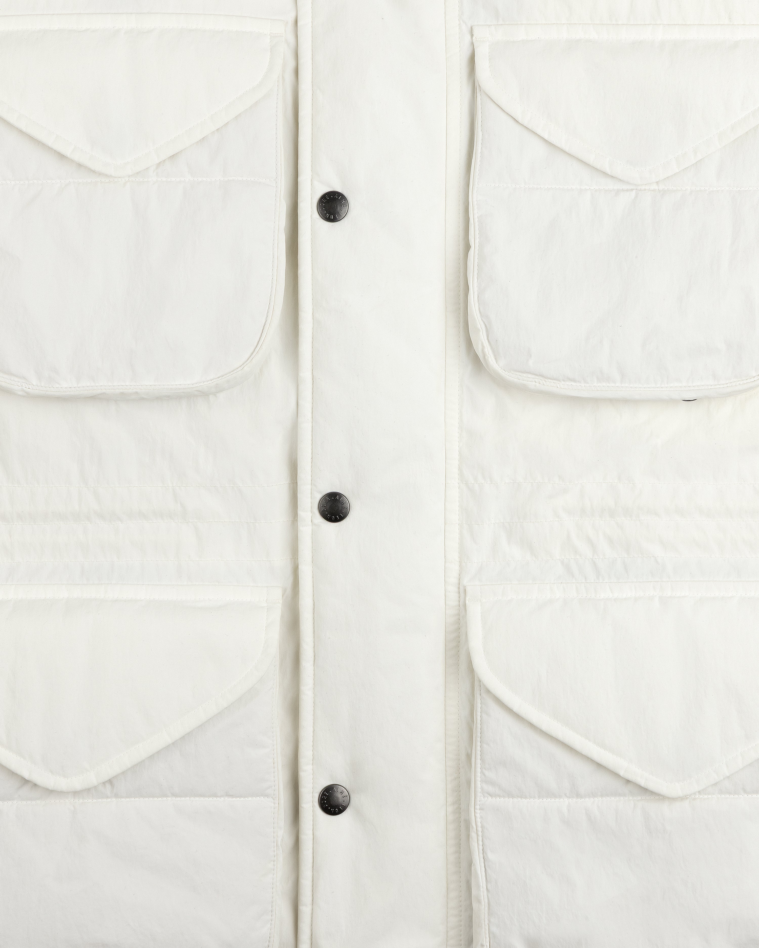 Off-white Down-Filled Surplus Parka with four flap pockets and a central snap-button closure.