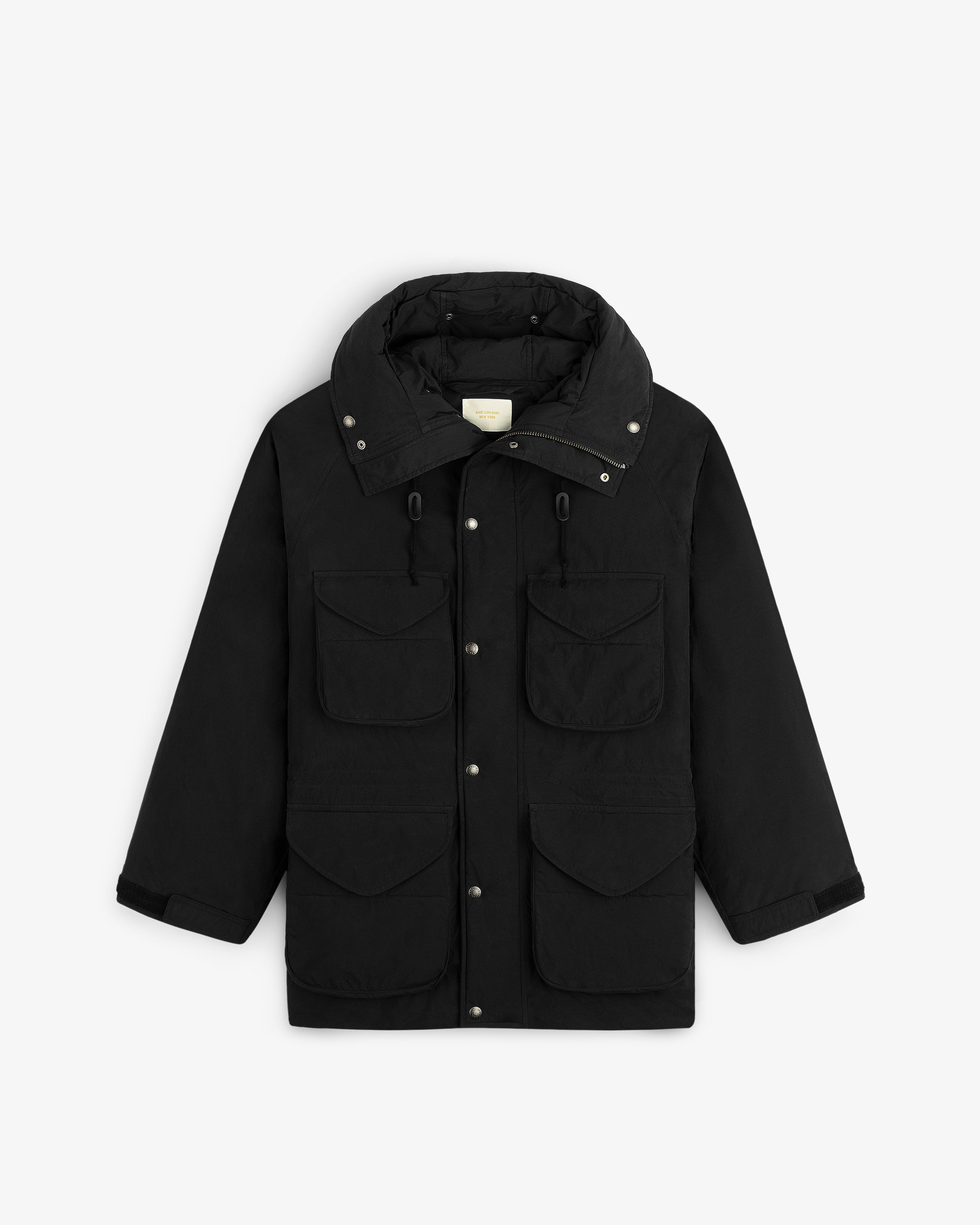 Down-Filled Surplus Parka: black hooded parka with a high collar, four front flap pockets, and a snap-button closure.