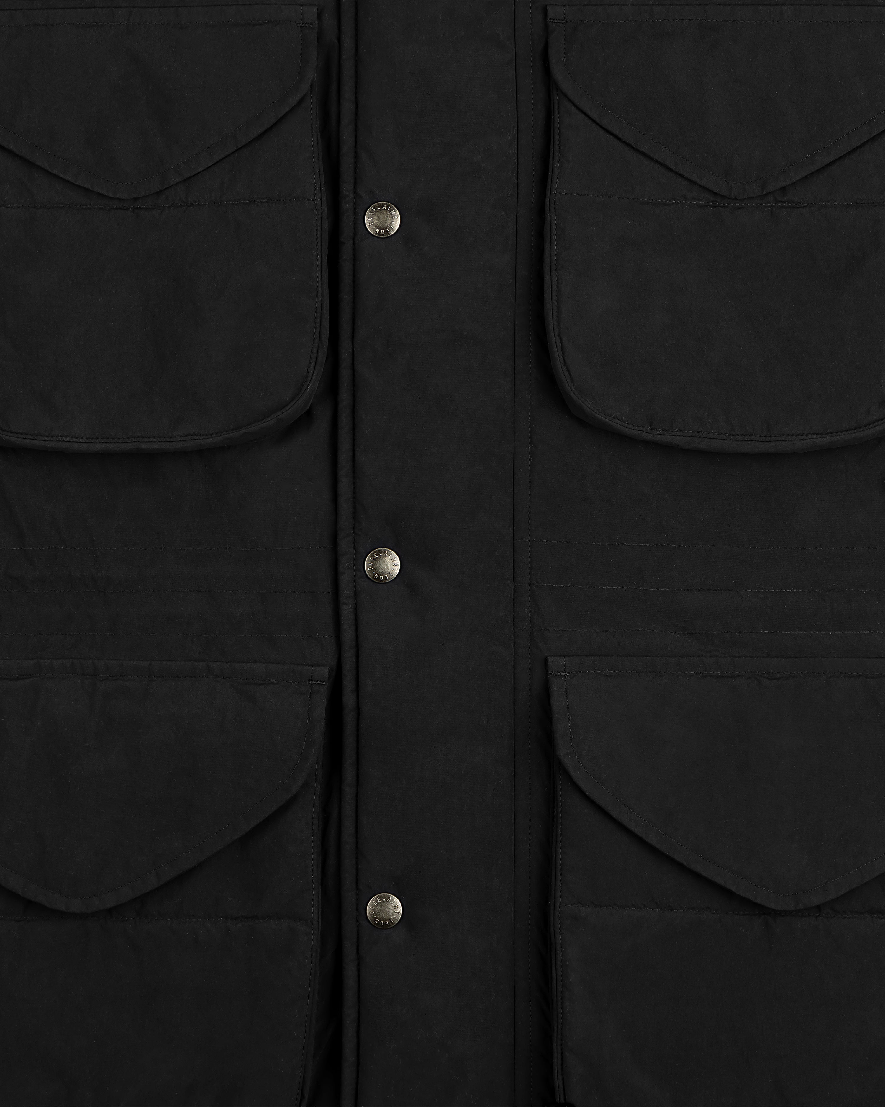 Close-up of a black Down-Filled Surplus Parka with four large flap pockets and a snap-button front closure.