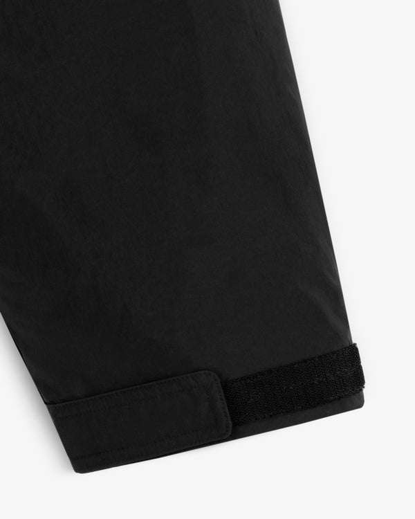 Close-up of a black Down-Filled Surplus Parka sleeve cuff with a velcro strap closure.