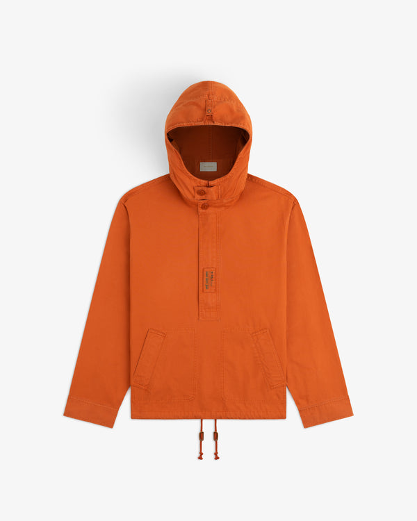 Garment Washed Anorak in orange, featuring long sleeves, a hood, a button placket, and front pockets.