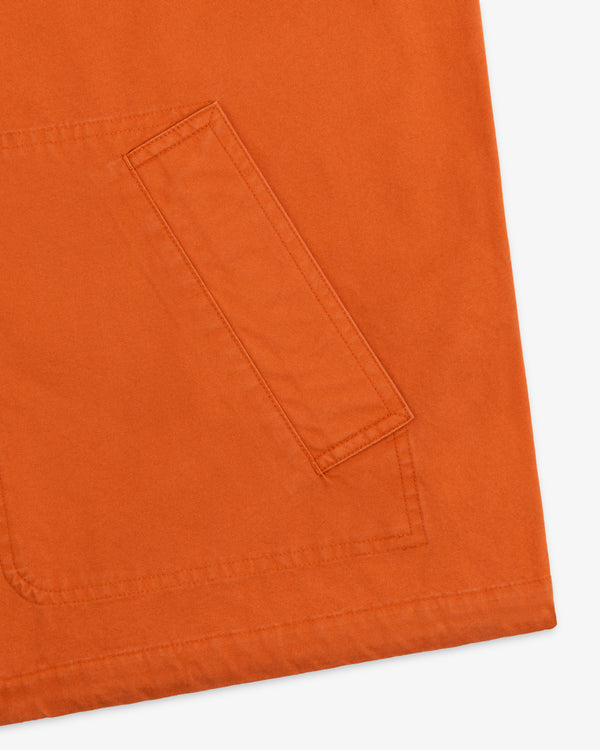 Close-up of a burnt orange pocket on a Garment Washed Anorak.