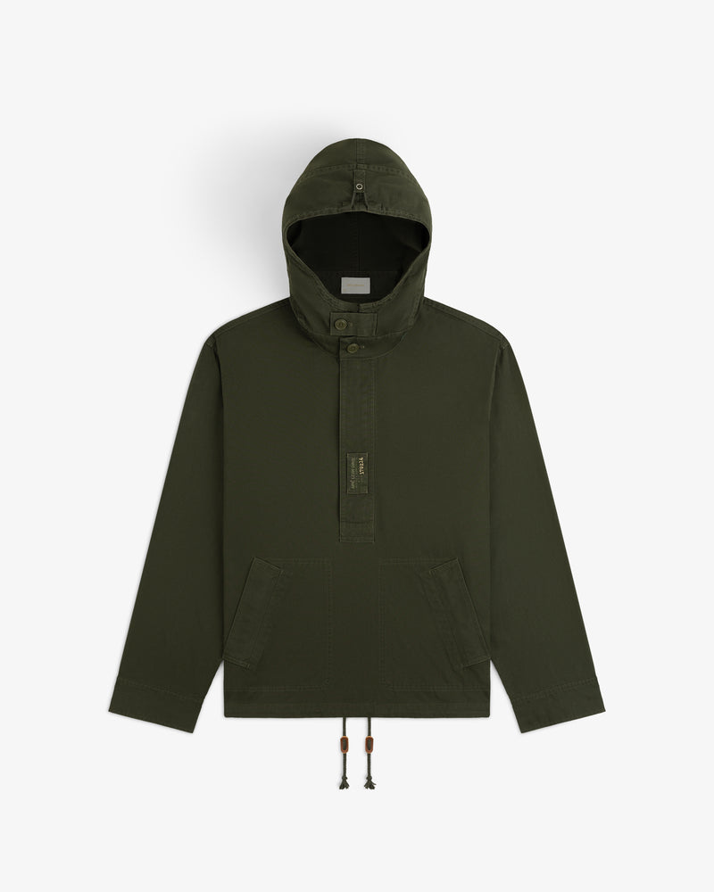 Garment Washed Anorak in olive green with a hooded pullover design, button placket, front pockets, and drawstring hem.