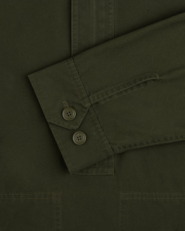 Olive green Garment Washed Anorak sleeve cuff with two buttoned closures.