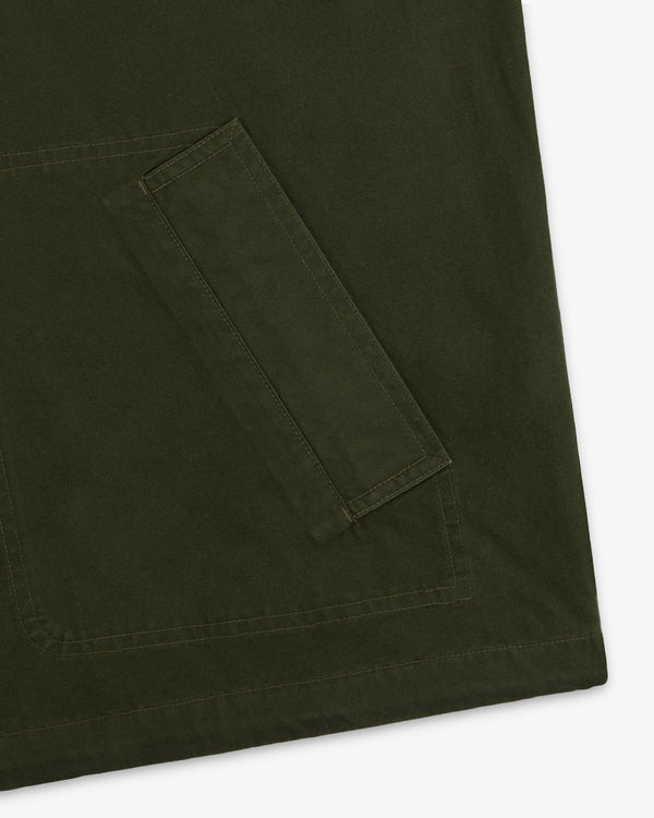 Close-up of a large olive green pocket with stitched detailing on a Garment Washed Anorak.
