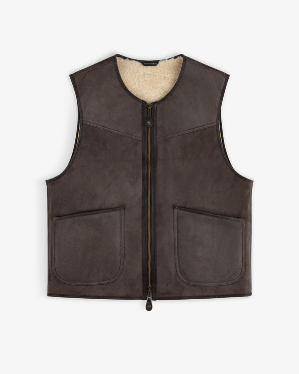 Shearling Biker Vest in dark brown suede with a cream shearling lining, front zipper, and two patch pockets.