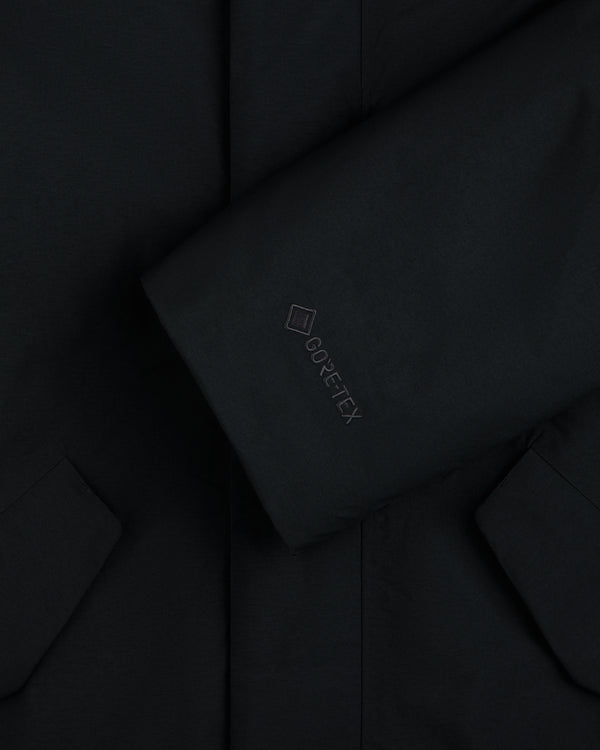Close-up of a black GORE-TEX Down Filled Fishtail Parka sleeve with a tonal logo.