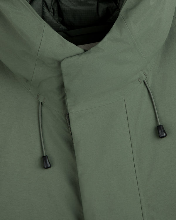 Olive green GORE-TEX Down Filled Fishtail Parka with high collar and adjustable drawstrings.