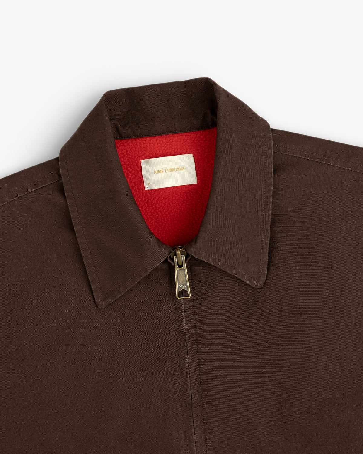 Fleece Lined Mechanic Jacket in dark brown with a bright red fleece lining and a zippered collar.