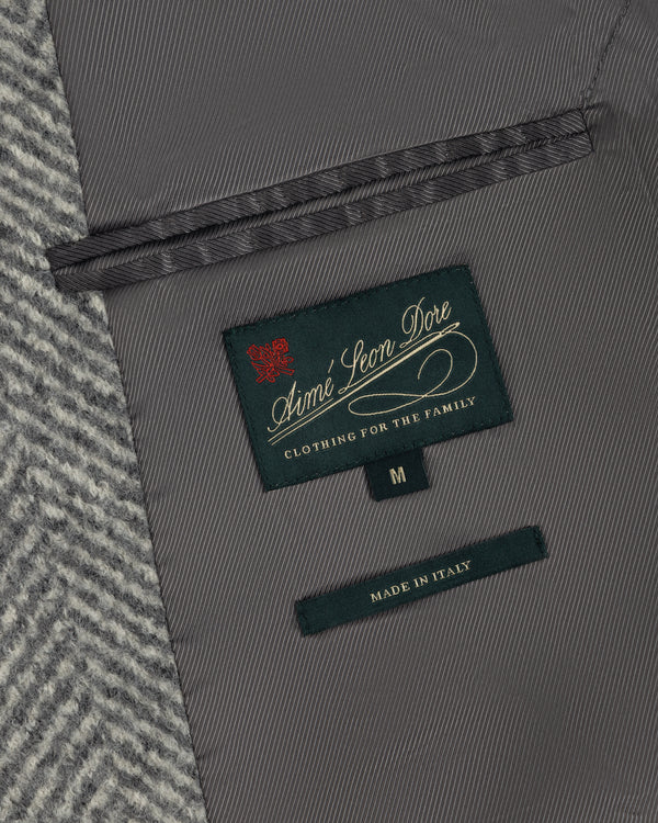 Close-up of the grey Wool Herringbone Overcoat interior, showing a branded label, size M tag, and Made in Italy label.