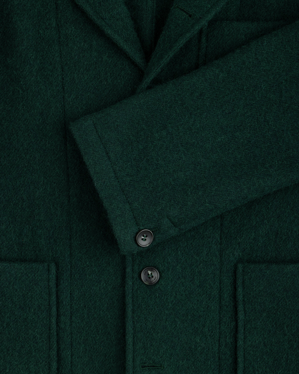 Dark green textured Wool Sport Coat with notched lapels, patch pockets, and dark buttons.