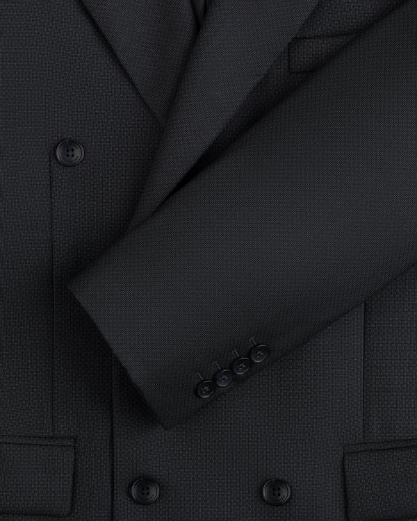 Close-up of a charcoal Double-Breasted Wool Jacquard Suit Jacket with buttoned sleeves and textured fabric.