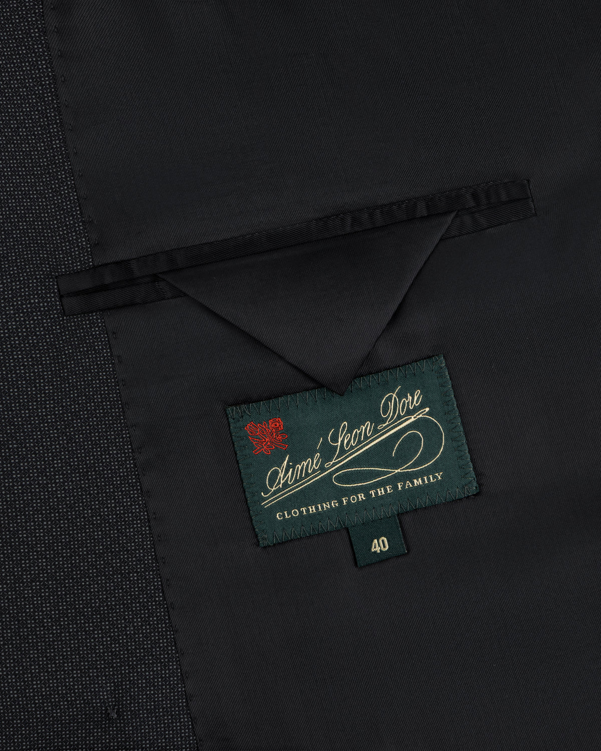 Interior of a Double-Breasted Wool Jacquard Suit Jacket showing a breast pocket and a green size 40 brand label.