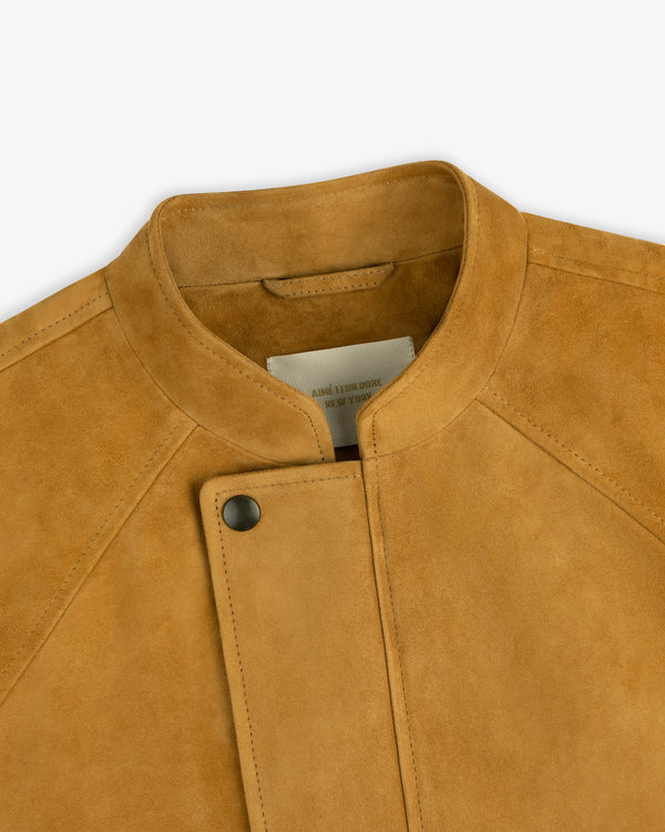Close-up of the Suede Cafe Racer Jacket in tan, featuring a snap button, standing collar, and partial interior label.